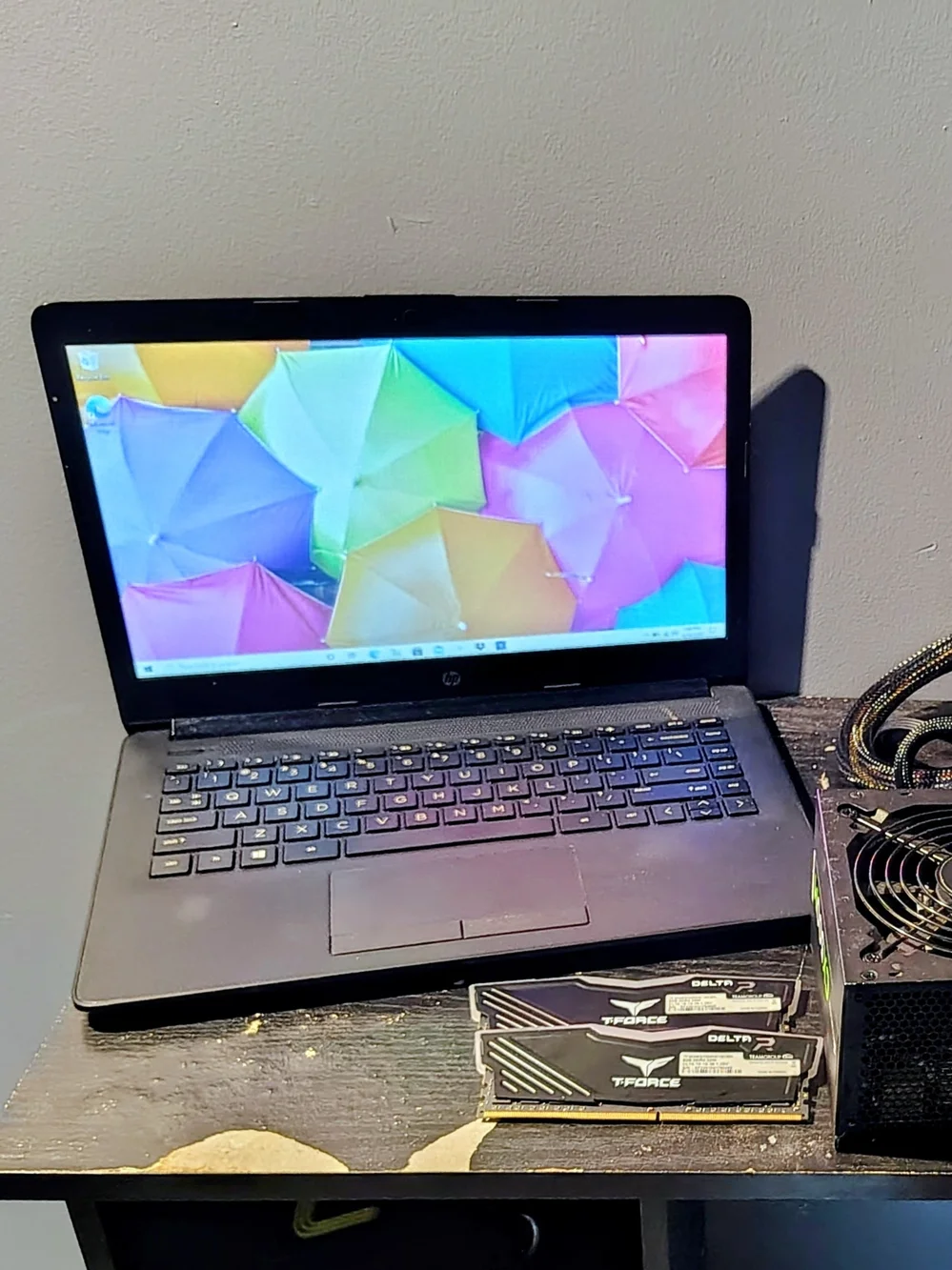 HP Black Laptop Lid with Colorful Sticker